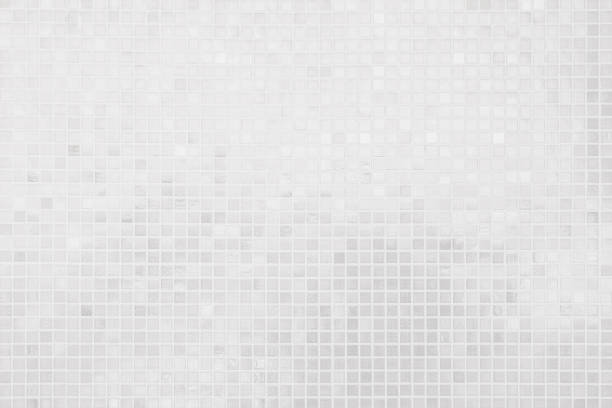 istock White or gray ceramic wall and floor tiles abstract background. Design geometric mosaic texture for the decoration of the bedroom and bath. Simple Seamless Poly art or Hypnotic at kaleidoscope. 1489567269