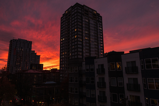 Seattle, USA - Nov 25, 2022: A vivid sunset over downtown as the nightly commute begins.