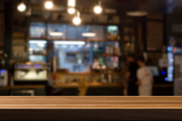 istock Cafe bar blurred background. Wooden table on cafe. 1489570581