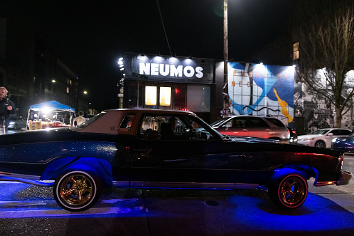 Seattle, USA - Apr 14th, 2023: Lowrider car club on Pike Street on Capitol Hill late in the evening.