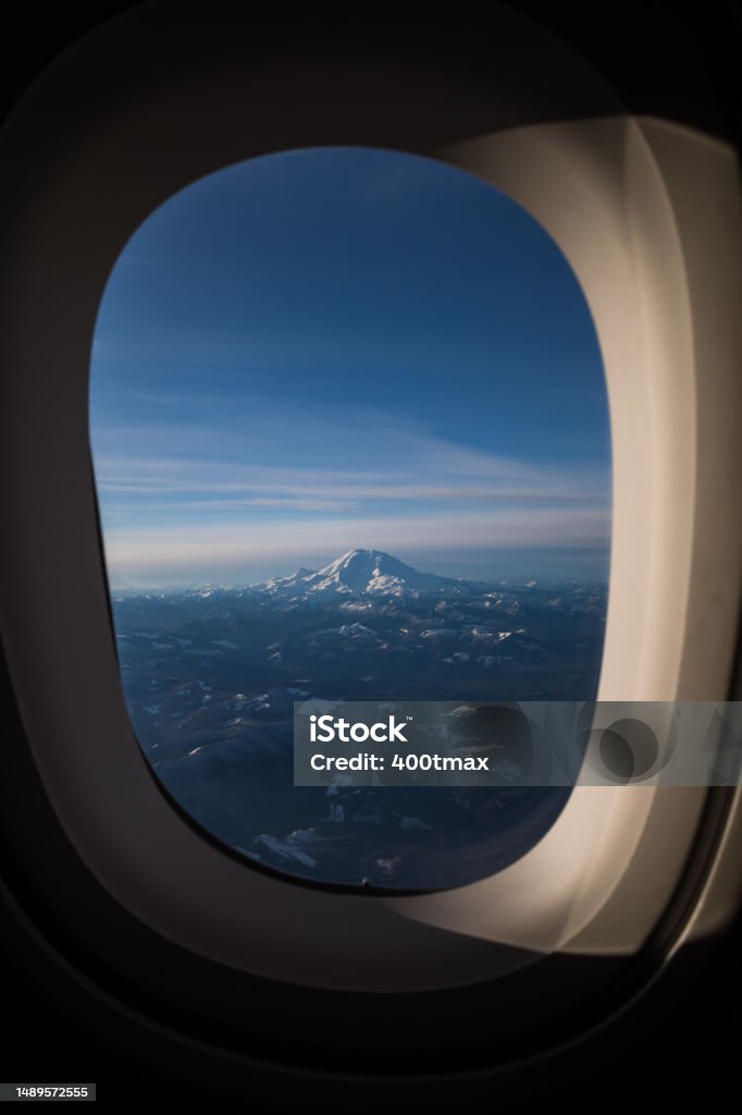 Seattle Mount Rainier from the air after departing Seatac Airport. Commercial Airplane Stock Photo