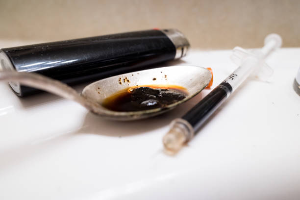 Drug Concept Simulated heroin in a dirty sink. fentanyl addiction stock pictures, royalty-free photos & images