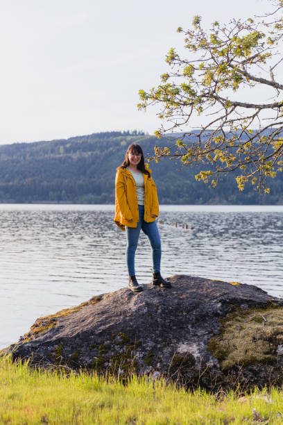 istock Woman In Nature With Yellow Jacket 1489575816
