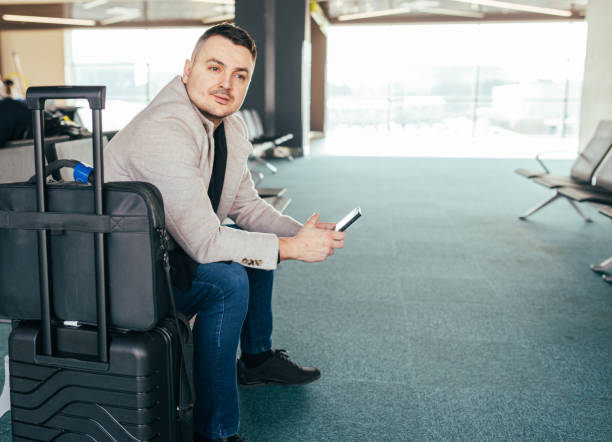 istock Male Traveler Waiting for His Flight 1489576374