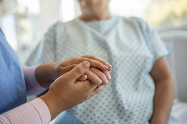 istock Nurse talking to elderly patient 1489580994