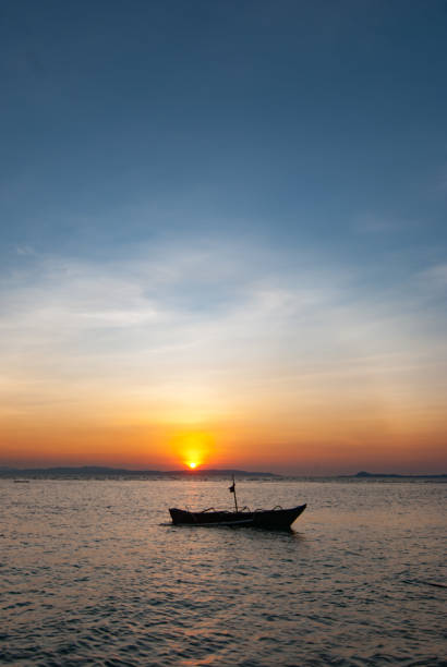 istock Fishing boat at dawn 1489581762