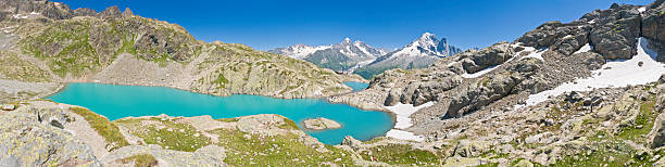 istock Alpine lake mountain summer hikers 148958268