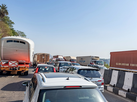 Khandala, India - May 12 2023: Slow moving traffic on the Mumbai Pune Expressway at Khandala India.