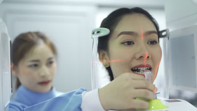 4K Female Radiologist Taking Dental X-Ray Of A Patient's Teeth