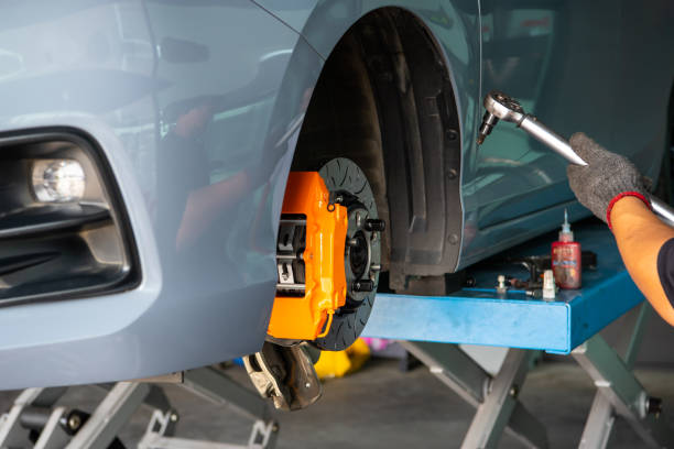 istock Checking car brake system for repair at car garage 1489596367