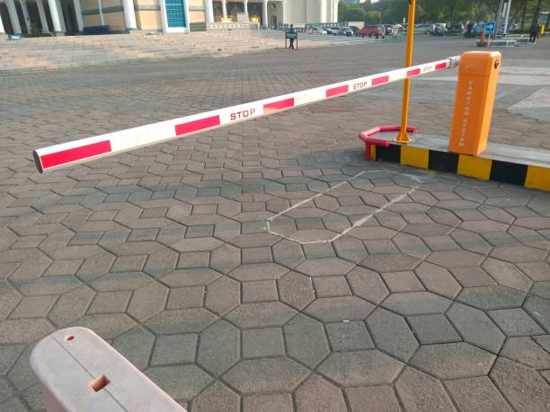 istock Arm raising barrier in building entrance. 1489604297