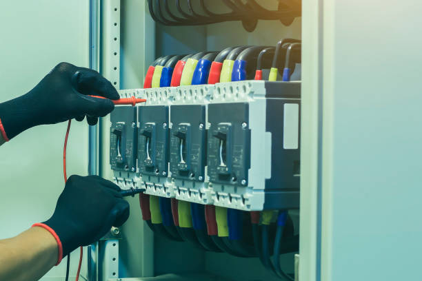 istock Electrical engineer checking the operation of electrical control cabinet, maintenance concept. 1489608965