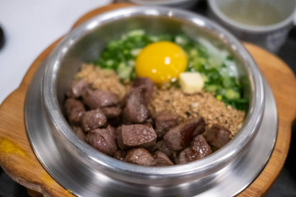 Beef steak rice in a steamed pot with egg. Korean food