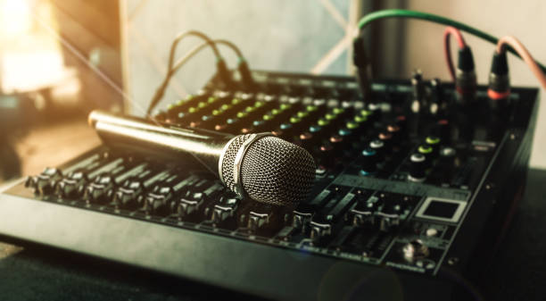 istock Close-up microphone and sound mixer in studio for sound record control system and audio equipment and music instrument. 1489623632