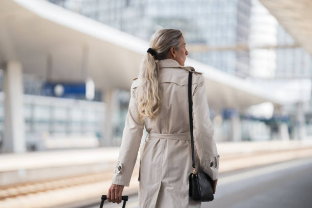 istock CEO urban commuter woman at railway station platform 1489624805