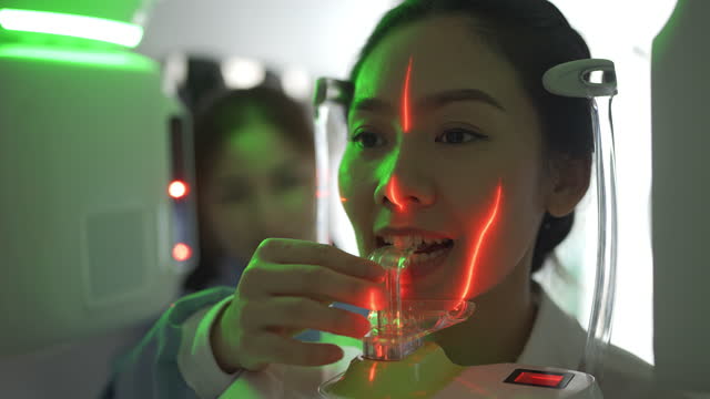 4K Dental Radiologist Taking A X-Ray Of A Patient's Teeth At Dental Clinic
