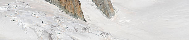 Mountaineers crevasse wilderness Intrepid Alpinists carefully picking a route through the huge crevasses and crumbling snowy serac of this white wilderness high in the European Alps; tremendous level of subtle detail in high resolution version. ProPhoto RGB profile for maximum color fidelity and gamut. leisure activity french culture sport high angle view stock pictures, royalty-free photos & images