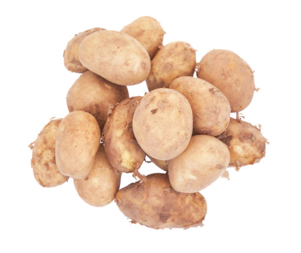 istock Fresh raw potatoes isolated on white background. Top view. 1489633654