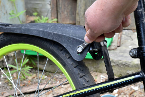 istock A mechanic tightens a bolt on a bicycle fender with a wrench. 1489638176