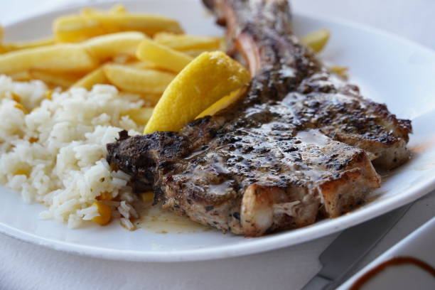 istock Grilled Giant Pork Chop with  chips and salad 1489639115