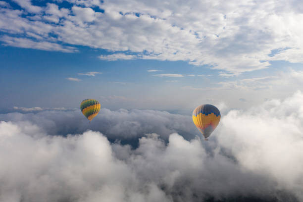 istock Colorful hot air balloon flying above the clouds. 1489642774
