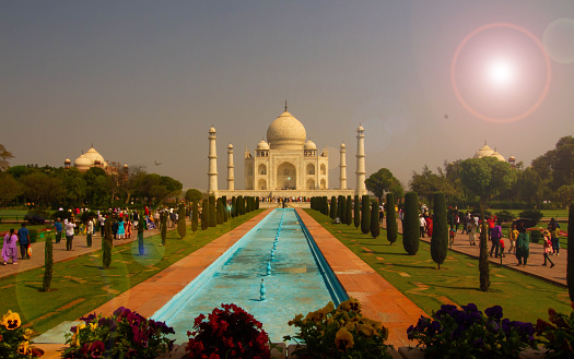 Agra,India-March 23,2023: The people visit Taj Mahal in Agra, India.This is one of the most recognizable structures in the world.Taj Mahal became a UNESCO World Heritage Site and was cited as the jewel of Muslim art in India.