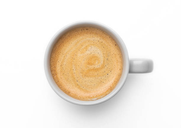 istock Coffee with creamy foam in small cup on white background. Top view 1489647417