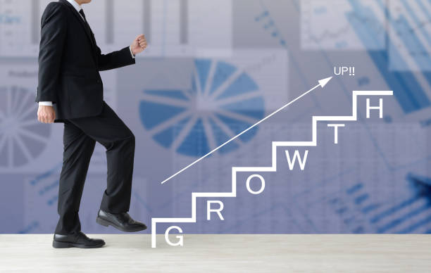 istock Business man climbing stairs with 