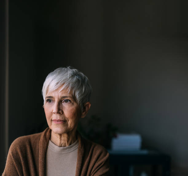 A Pensive Beautiful Woman Looking Away While Standing Indoors