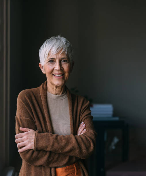 istock A Happy Beautiful Woman Looking At Camera While Standing Indoors 1489663319
