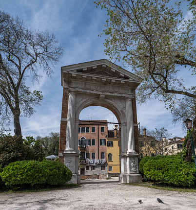Venice, Italy - April 27, 2023: High resolution. Beautiful old arch in a park on east Venice.