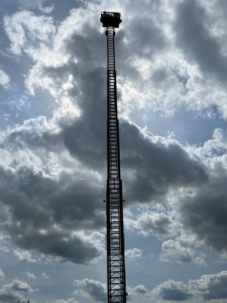 istock Fire department turntable ladder in backlight. 1489669748