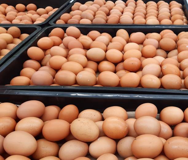 istock Pile of eggs from horn chickens (leghorns) or broiler chickens in a black plastic container at the supermarket 1489674824