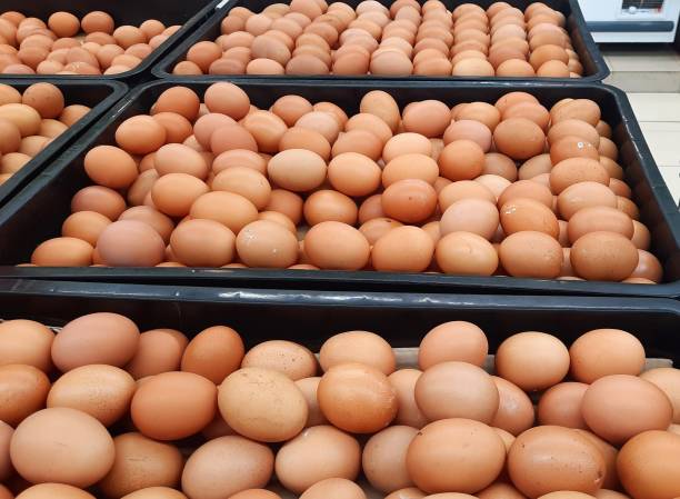 istock Pile of eggs from horn chickens (leghorns) or broiler chickens in a black plastic container at the supermarket 1489674838