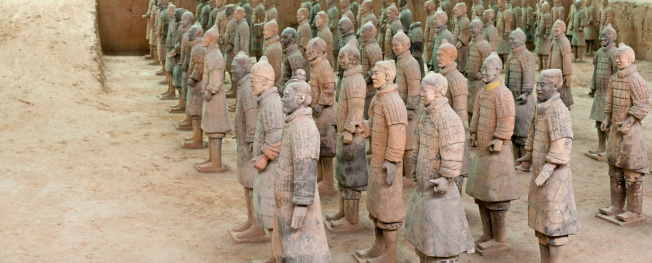 XIAN, CHINA - October 8, 2017: Famous Terracotta Army in Xi'an, China. The mausoleum of Qin Shi Huang, the first Emperor of China contains collection of terracotta sculptures of armored men and horses.