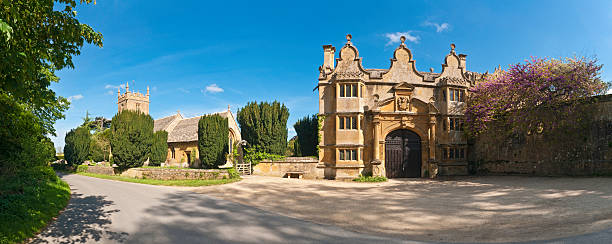 istock Cotswold gatehouse pretty churchyard quiet lane 148967915