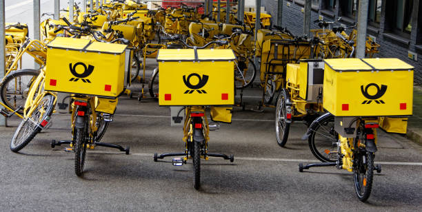 german post bicycles - deutsche post ag package germany occupation imagens e fotografias de stock