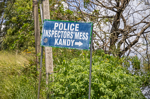 Kandy, Central Province, Sri Lanka - February 25th 2023:  This sign is standing in a suburb to Kandy and is showing the direction to the Police Inspectors Mess