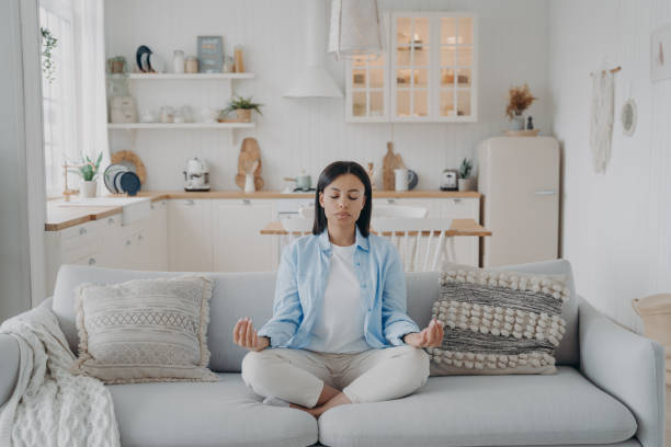 istock Peaceful mind, zen and concentration. Young hispanic woman is practicing yoga at home. 1489681049