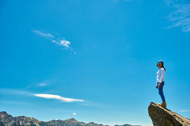 Hiker on the top of the mountain peak.