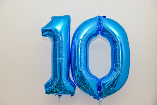 One and zero blue helium balloons make a great celebration surprise for a ten year anniversary or tenth birthday