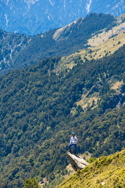 istock Hiker on the top of the mountain peak. 1489683370