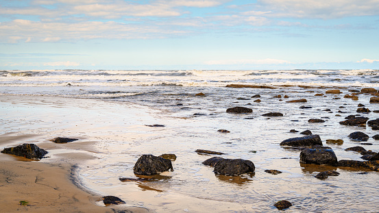 Cambois Beach is located between the rivers Blyth and Wansbeck on the Northumberland coast and is a long stretch of sand backed by rocks and grassy dunes