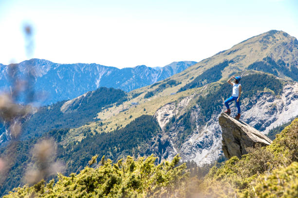 Hiker on the top of the mountain peak.