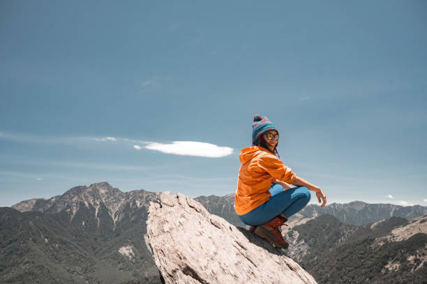 Hiker on the top of the mountain peak.