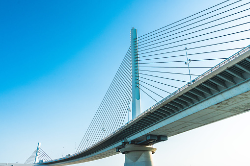 Close up of the Ravenel suspension bridge detail against bright blue sky in Charleston, South Carolina, USA