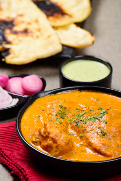 istock Butter chicken closeup with naan and mint chutney 1489687507