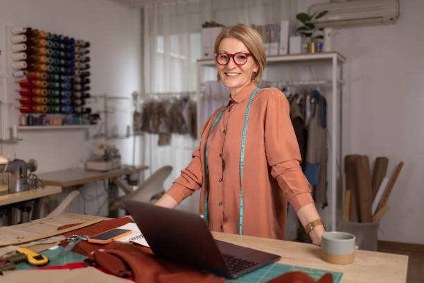 istock Happy mature designer working in a design studio. 1489702266