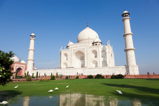 View of the Taj Mahal in Agra, India. It is one of the eight wonders of the world and was built by Mughal emperor Shah Jahan in memory of his third wife in 1632-1653. It has also become a UNESCO world heritage site. It was built using marble in the achitectural  Mudhal, Islamic and Persian. styles and is highly decorated with writings, motifs, and tiles. Taken with Canon 5D Mark2