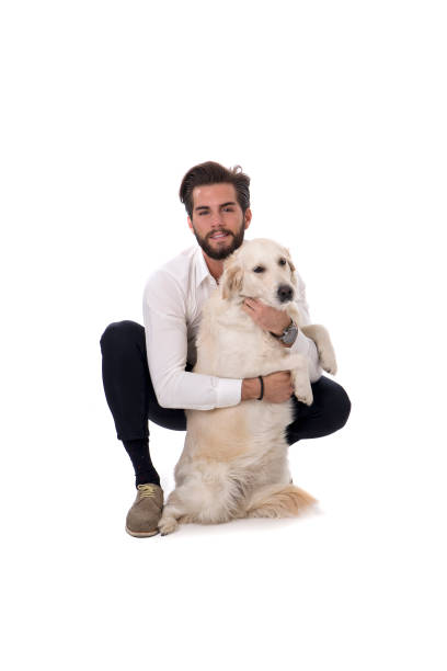 istock Young man with white dog in studio 1489713369